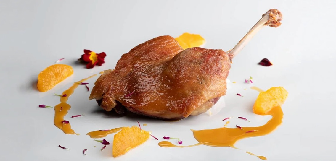 Confit de pato con salsa de cítricos